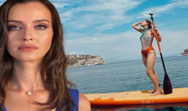 Tekne tatiline çıkan İrem Helvacıoğlu kano üzerinde poz verdi