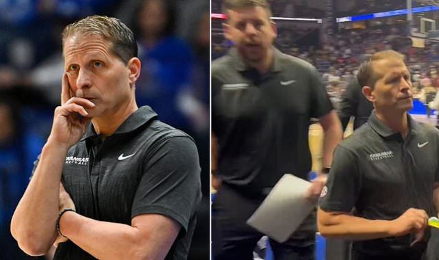 Arkansas coach has to be restrained, staffer throws reporter's phone