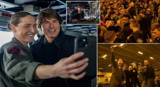 Beaming Tom Cruise visits US Navy aircraft carrier