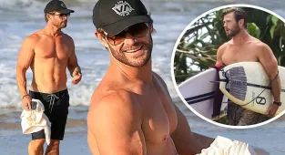 Chris Hemsworth shows of muscular physique at the beach in Australia