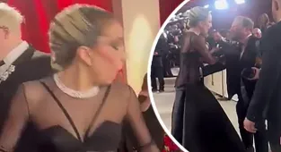 Lady Gaga swoops in to help photographer who fell on Oscars red carpet
