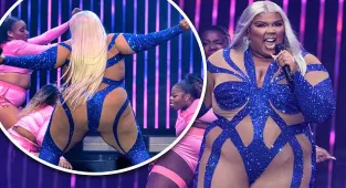 Lizzo puts on a confident display in a VERY daring cut-out jumpsuit