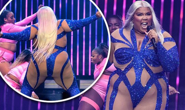Lizzo puts on a confident display in a VERY daring cut-out jumpsuit