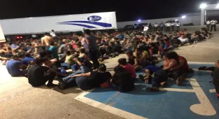 Youth found in abandoned truck trailer returned to Guatemala