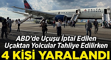 ABD'de Uçuşu İptal Edilen Uçaktan Yolcular Tahliye Edilirken 4 Kişi Yaralandı!