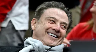 CBS can't stop zooming on busty March Madness fan sat near Rick Pitino