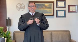 Gun-toting judge's video sparks backlash from colleagues