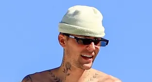 Justin Bieber climbs on a rooftop after speaking out about wellbeing