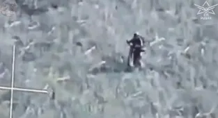 Russian troops ride into frontline on E-SCOOTERS before being droned