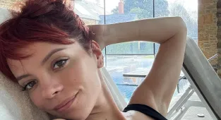 Swimsuit-clad Lily Allen reveals boob job a on a mini break