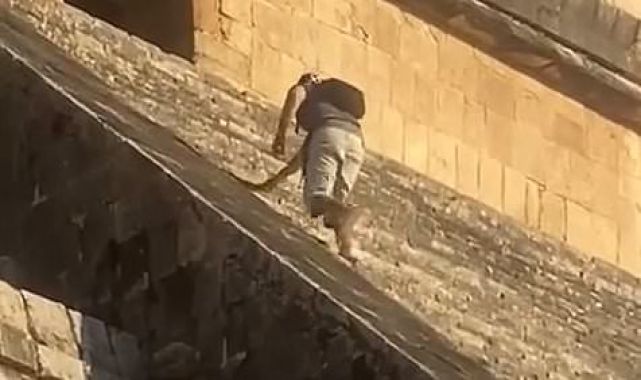 Tourist dragged away by security after climbing steps of Mayan temple