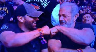 UFC fans go wild as Trump's FBI boss and Mel Gibson fist bump in Vegas