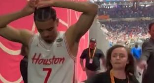 Bizarre moment woman grabs devastated Houston basketball star