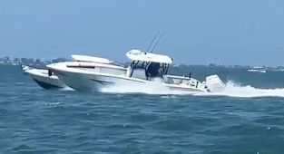 Crazy moment Florida officer jumps onto high-speed runaway boat