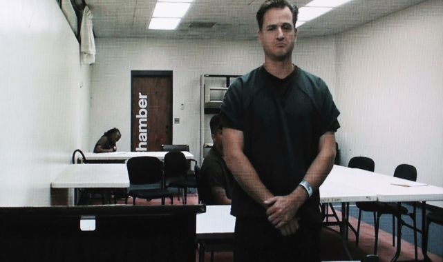 Hawaii doctor accused of trying to kill his wife on hiking trail pleads not guilty