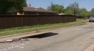 Horror as driver's car disappears into sinkhole