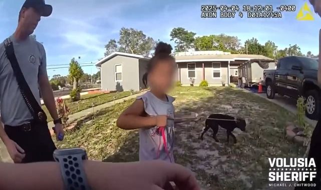 Moment homeless girl, 6, is found wandering streets with dog