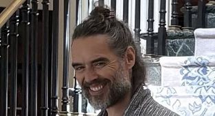 Russell Brand seen for first time after being charged with rape