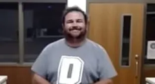 Teacher smirks after being arrested for 'having sex with minors'