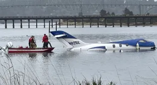 Terror as private jet skids off runway and crashes into bay