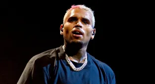 Chris Brown arrested in Manchester over bottle attack