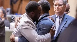 Cops hug and cry as they're CLEARED in death that shocked America