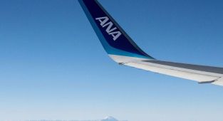 Flight from Tokyo diverted to Seattle after passenger tries to open exit doors