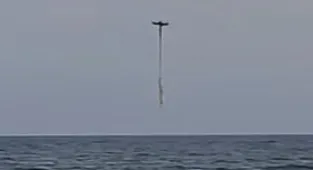 Footage captures moment drowning girl is saved by fisherman's drone