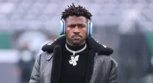 Gun-wielding ex-NFL star 'fights off attackers' in wild brawl