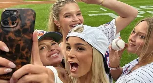 Livvy Dunne joined by SI swimsuit models on the field for first pitch