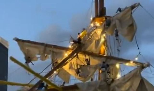 Sailors hang in the air from navy vessel's mast after ship crashed