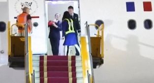 Shocking moment Macron 'is shoved in the face' by wife Brigitte