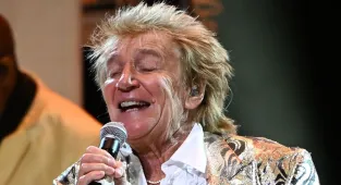 Sir Rod Stewart is escorted to his car  following boozy night out