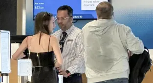 Bill Belichick sweats through clothes at airport with Jordon Hudson