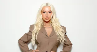 Christina Aguilera looks thinner than ever in suit and kinky boots