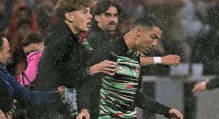 Cristiano Ronaldo grabbed by pitch invader ahead of Portugal match