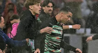 Cristiano Ronaldo grabbed by pitch invader ahead of Portugal match