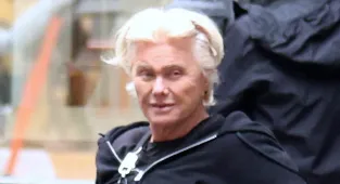 Deborra-Lee Furness goes makeup free as she rides an electric scooter