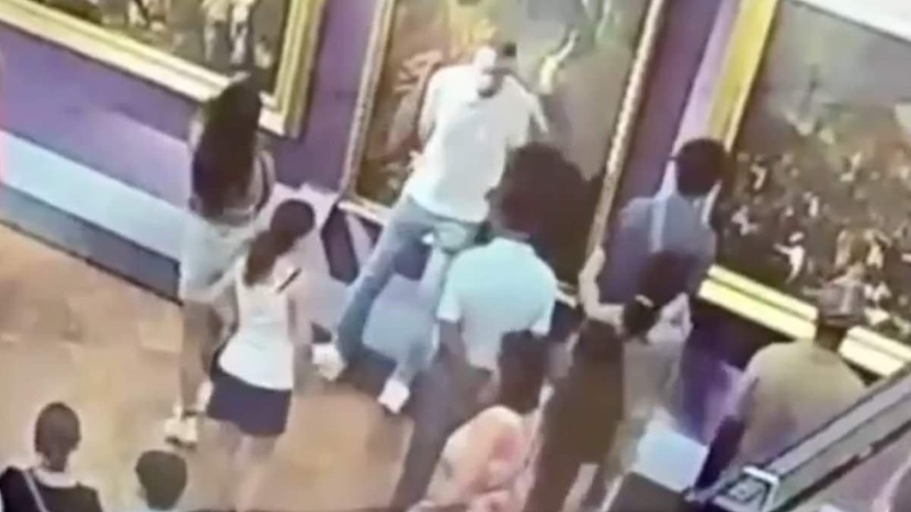 Fury as tourist tears a hole in painting while posing for a selfie