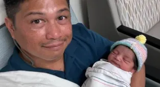 Gay dads charged after adopted baby girl died in the back of a hot car