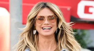 Heidi Klum shows off midriff in skimpy bikini top and double denim