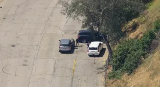 ICE agents descend on Dodger Stadium two weeks after LA riots