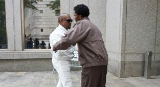 Kanye hugs Diddy's son as he crashes rival rapper's trial