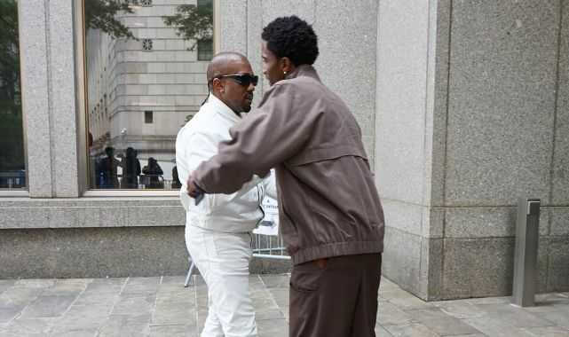 Kanye hugs Diddy's son as he crashes rival rapper's trial