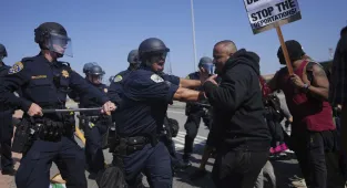 LA police swiftly enforce downtown curfew as protests continue