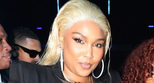 Lizzo showcases her incredible weight loss in a tight leather corset