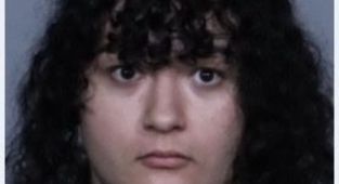 Masked flag-wielding trans protestor arrested for attacking activist