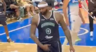 Moment ex-NBA superstar swings punches and brawls with fans