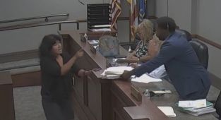 Petty war erupts at town meeting... and it was all caught on camera