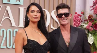 Robin Thicke and April Love Geary flash wedding bands for FIRST time
